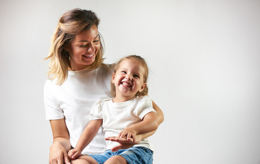 Happy Mother with cute daughter portrait child on white background with copy space