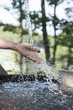 © Liz Clayman - Hand splashing water in a hot tub
