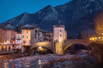 13th century historic toll bridge over Bevera river at dusk in Sospel, Alpes-Maritimes, France