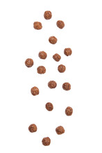 Chocolate cereal balls falling isolated on white background.
