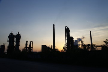 Industrial plant equipment in the sunset