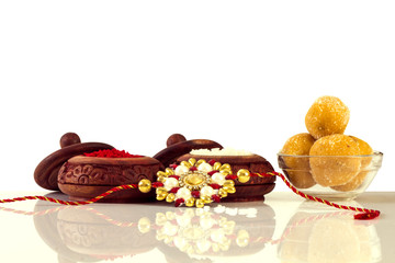 Wall Mural - Raksha Bandhan rakhi with sweets diya and gift