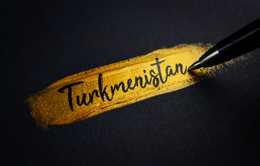 Turkmenistan Handwriting Text on Golden Paint Brush Stroke