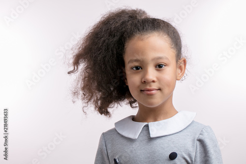 Portrait Of Cute Little Beautiful Mulato Girl With Luxury