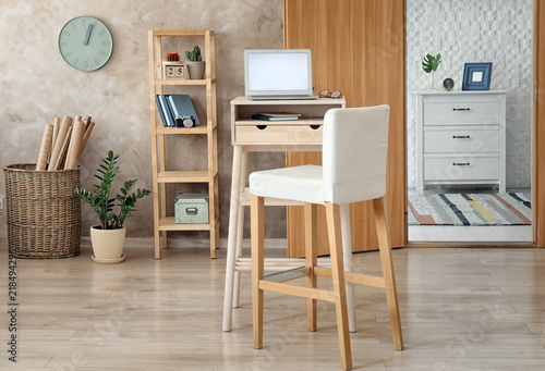 High Wooden Table With Laptop As Stand Up Workplace In Modern