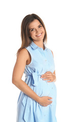 Wall Mural - Happy pregnant woman touching her belly on white background