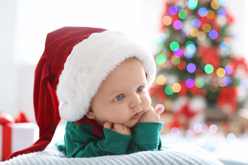 Wall Mural - Cute baby in Christmas costume at home