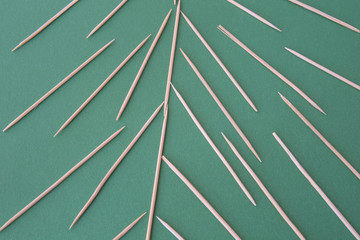 toothpick on green background