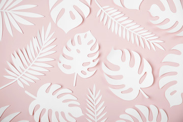 Tropical leaves pattern. Various paper leaves on pastel background. Paper art. Flat lay, top view