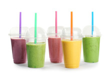 Plastic Cups With Fresh Tasty Smoothies On White Background