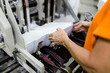 © hedgehog94 - Close up shot of worker's hand preparing carton for printing in a modern printing house.