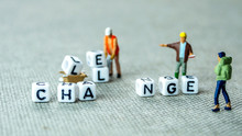 Removing White Cubes With Letters L And E Of The Word Challenge Creating New Word Change On Grey Background With Miniature Figurines