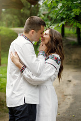  Beautiful bride and groom in the ukrainian style are standing w