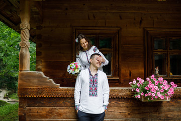  Beautiful bride and groom in the ukrainian style are standing w