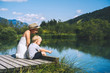 Mother and son relaxing on nature. Zelenci lake, Slovenia, Europe.