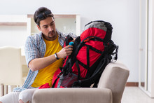 Backpacker Packing For His Trip