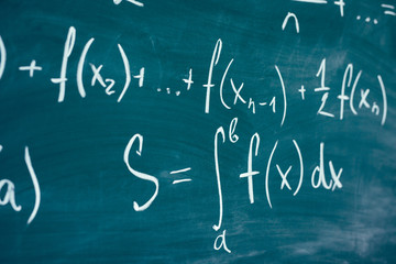 Wall Mural - Mathematics function integra formulas written by chalk on the chalkboard.