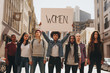Leinwandbild Motiv Group of women marching on the road in protest