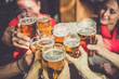 © oneinchpunch - Group of teens having fun in a pub