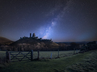 Wall Mural - vibrant milky way composite image over landscape of medieval castle ruins