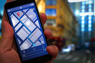 Poster - Close up of Tourist using GPS map navigation on smartphone application screen for direction to destination address in the city with travel and technology concept.
