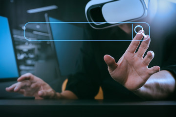Poster - businessman wearing virtual reality goggles in modern office with mobile phone using with VR headset