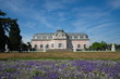 © Peeradontax - View of Schloss Benrath, old classic residence palace and small garden with white and  purple garden in front of building in Dusseldorf, Germany