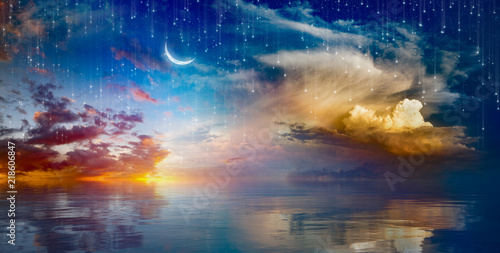 Photographie Vibrant surreal background - crescent moon rising above serene sea