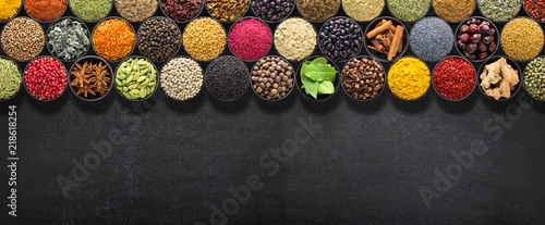 Plakaty do kuchni spices-and-herbs-for-european-food-seasoning-on-black-table-with-space-for-recipe-or-text