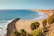 Sandy beach in Playa del Ingles, Gran Canaria, Canary islands, view of the sea, umbrellas, beach, selective focus