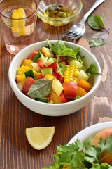 Wall Mural - Salad with sweet corn, cucumber, sweet pepper and peach with ingredients, vertical