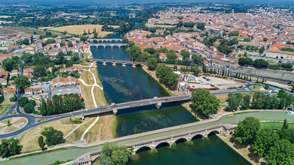 Aerial top view of Beziers town, river and bridges from above, South France
