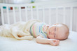 © Ekaterina Pokrovsky - Baby girl sleeping in co-sleeper crib