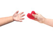 © weerapat1003 - Baby's hands giving and taking a red heart isolate on white
