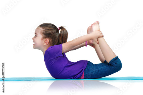 Little girl practicing bow yoga pose laying on belly - Buy this stock photo and explore similar images at Adobe Stock | Adobe Stock Little girl practicing bow yoga pose laying on belly - Buy this stock photo and explore similar images at Adobe Stock | Adobe Stock