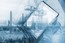 Double Exposure, A Man Using Digital Tablet And Buildings Construction With Cityscape