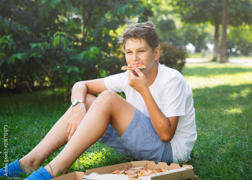 Cute Young 11 Years Old Boy With Hot Delicious Pizza In The Green Summer Park Buy This Stock Photo And Explore Similar Images At Adobe Stock Adobe Stock