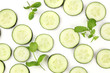 Cucumber slices and mint leaves on white, a fresh background