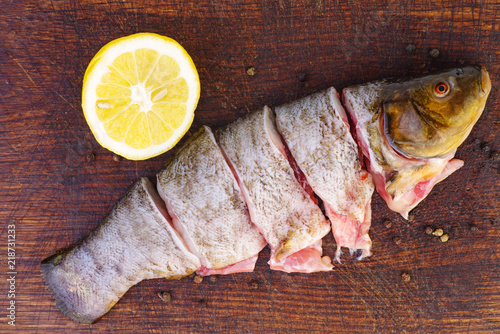 Fényképezés Sliced ready-to-cook tench fish and lemon