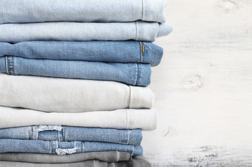 Wall Mural - Stacked blue and grey jeans