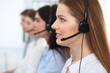 © rogerphoto - Call center. Beautiful cheerful smiling operator consulting clients with headset. Business concept of customer service