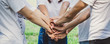 © Nattakorn - Stacking hands of young teen student, teamwork, togetherness and cooperation concept