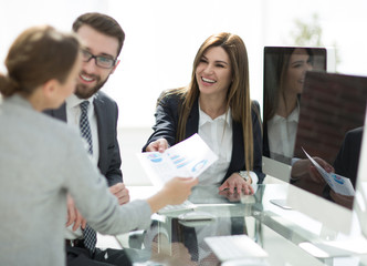 Canvas Print - business team sitting at the Desk