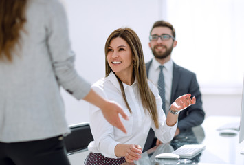 Canvas Print - smiling employees talking in the workplace.