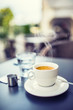 © weyo - Cup of coffee on table in restaurant terrace