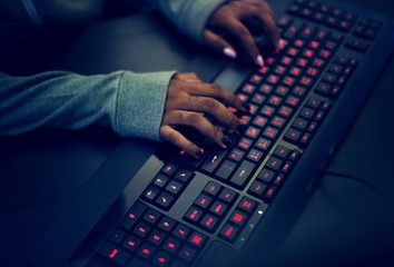 Wall Mural - closeup of hands working on computer keyboard