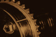 © Daniil - Monochrome background image of gear close up. Artwork from auto part in macro photography. Sepia tones.