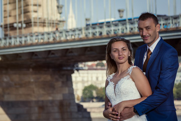 young happy romantic wedding couple outdoors in city