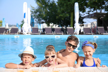 Poster - Cute children in swimming pool on summer day