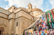 Florence street life: cathedral with clothing market near
